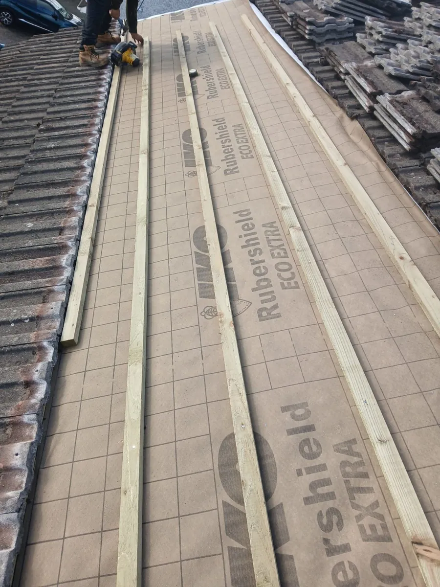 New battens on breathable membrane with concrete tiles stacked ready to relay, Global Roofing and Guttering, Dublin