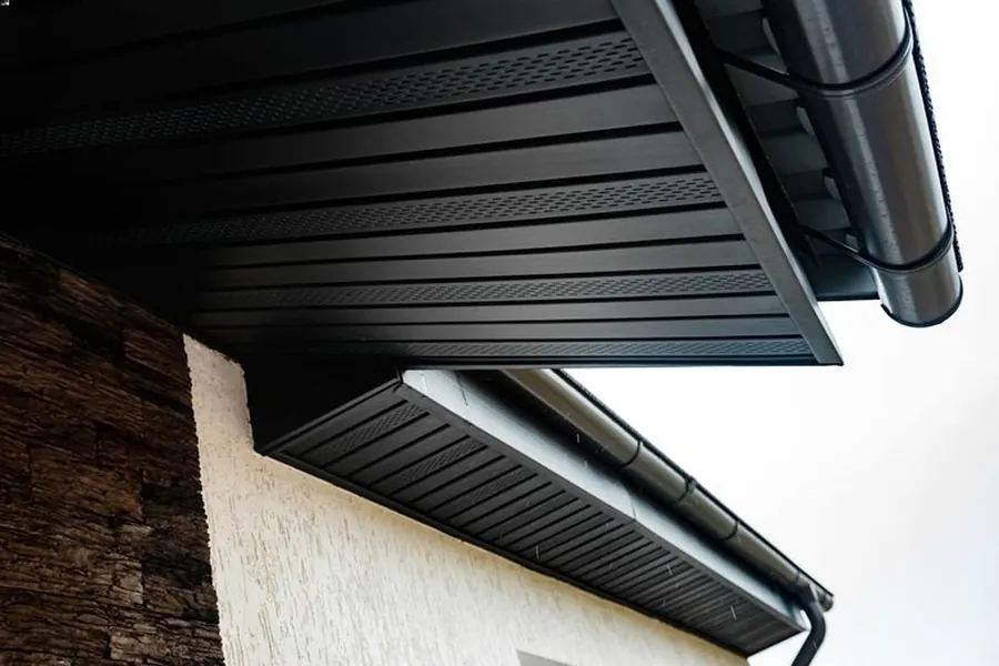 New black uPVC fascia, vented soffit and gutter on a roofline, Global Roofing and Guttering, Dublin