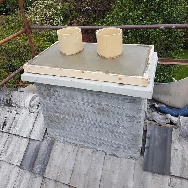 Rebuilt chimney stack rendered and capped with two new pots, Global Roofing and Guttering, Dublin