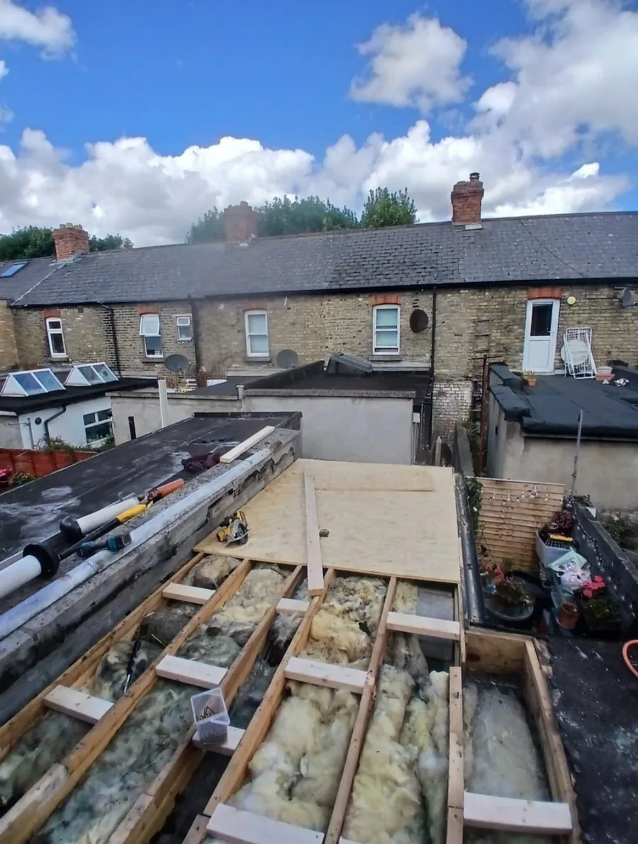 Flat roof extension opened up to new joists and insulation behind a terrace, Global Roofing and Guttering, Dublin